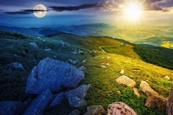 white boulders on the hillside with sun and moon at summer solstice. day and night time change concept. mysterious countryside scenery in morning light