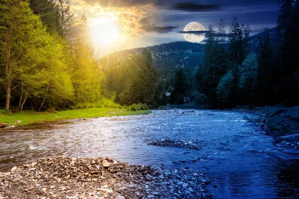 landscape with mountain river at summer solstice. carpathian scenery with forest on the shore beneath a sky with sun and moon. day and night time change concept