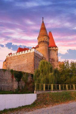 hunedoara, romania - 13 oct, 2019: corvin castle at sunrise. transylvania heritage. myth and history of europe background clipart