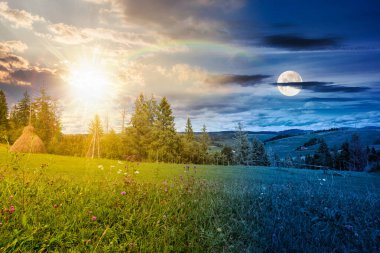Sonbahar ekinoksunda kırsal alan. Gündüz ve gece değişiyor. Yuvarlanan tepeleri olan kırsal bir manzara. Alacakaranlıkta güneş ve ay olan dağ manzarası. taşra macerası