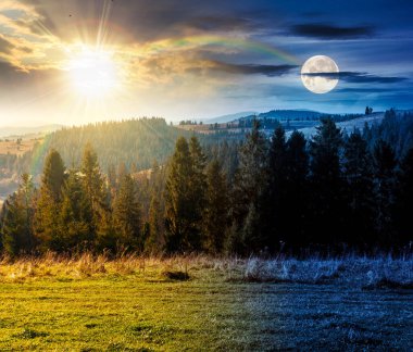 Sonbahar ekinoksu sırasında dağların kırsal kesiminde. Gündüz ve gece zaman kavramını değiştirir. Alacakaranlıkta güneşli ve aylı harika dağlık arazi yamaçtan gözlendi. Ladin Ormanı yakınlarındaki yuvarlanan tepelerdeki çayırlar
