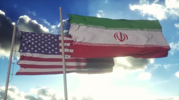 イランと米国は旗竿に旗を翻す イランと米国は風の中で旗を振っている イランとアメリカの外交概念 — ストック動画