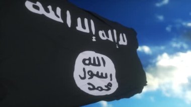 Isis bayrağı rüzgarda dalgalanıyor. İslami terör devletini temsil eden siyah ve beyaz bayrak.