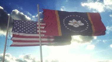 The Mississippi state flags waving along with the national flag of the United States of America. In the background there is a clear sky.