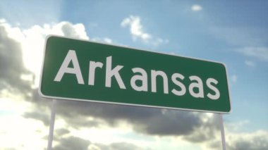 Arkansas 'a hoş geldiniz. Arkansas yol tabelası mavi gökyüzünde. Arkansas istikametinde şehre varış. Seyahat, iş, turizm ve ulaşım kavramı.