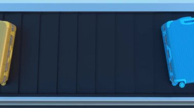 Bagajlar havalimanı taşıma bandında, yukarıdan görünüyor. Farklı renkte valizler.