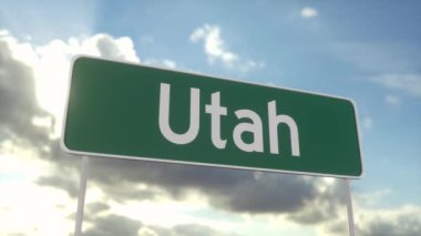 Utah 'a hoş geldiniz. Mavi gökyüzünde Utah yol tabelası. Seyahat, iş, turizm ve ulaşım kavramı.