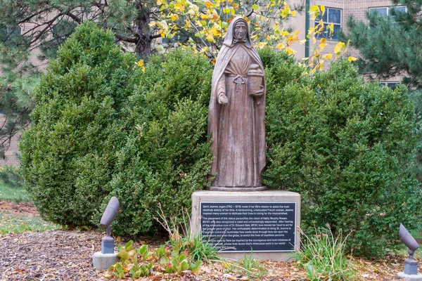 stock image OMAHA, NE, USA - NOVEMBER 4, 2022: Saint Jeanne Jugan statue on the campus of Creighton University.