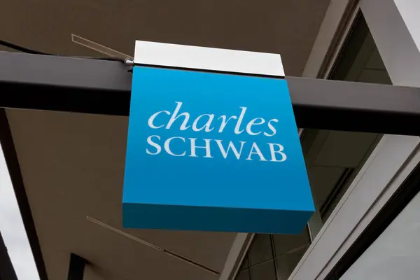 stock image WOODBURY, MN, USA - NOVEMBER 11, 2023: Charles Schwab financial services office sign and trademark logo.