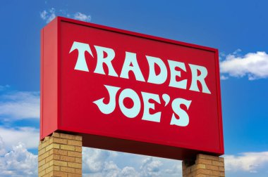 EAGAN, MN, USA - MARCH 7, 2024: Trader Joe's grocery store sign and trademark logo. clipart