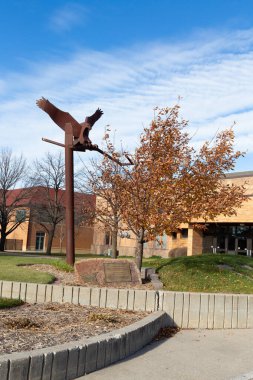 CROOKSTON, MN, USA, NOVEMBER 18, 2024: The Golden Eagle Monument at the University of Minnesota Crookston. clipart