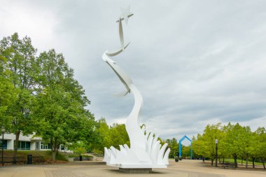 ALLENDALE, MI, USA, SEPTEMBER 20, 2024: Heaven and Earth sculpture on the campus of Grand Valley State University. clipart