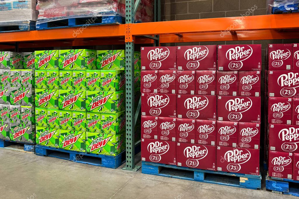 WOODBURY, MN, USA, APRIL 22, 2025:Wholesale club display of Dr. Pepper and Mountain Dew soda and trademark logos.
