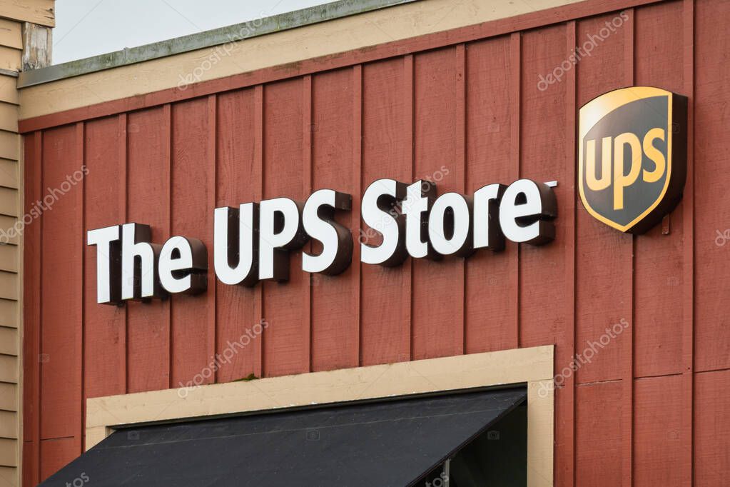 REDMOND, WA, USA, MAY 26, 2025: The UPS Store exterior sign and trademark logo.