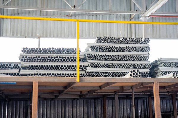 PVC pipes stacked in warehouse. High quality photo