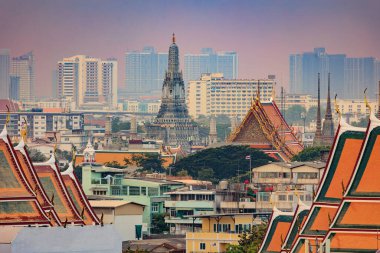 View on the Bangkok old city and the Wat Arun temple with modern city. clipart