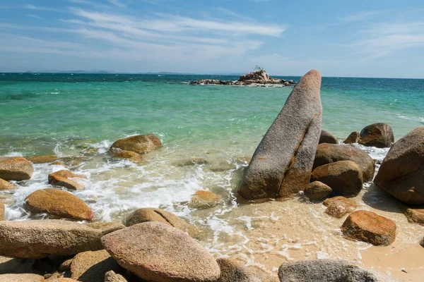 Beautiful seascape with natural stone arch over turquoise sea against blue sky at separate sea, called Thale Waek, in Ko Man Klang, Rayong, Thailand. travel summer destination in tropical country,Siam