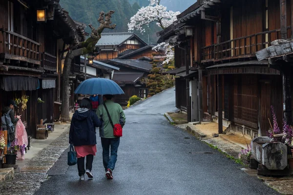 Rear Couple Hold Umbrella Walk Post Preserved Old Wooden Buildings — Stock Photo, Image