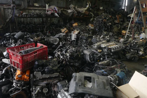 Used second hand car spare parts for sale in garage. Vehicle fixing industry.
