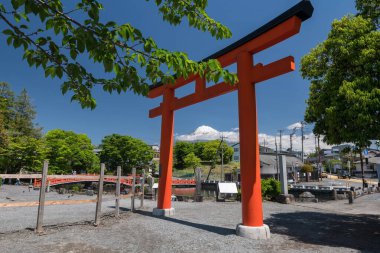 Red Torii gate at Fujisan Hongu Sengen Shrine with mount Fuji against blue sky view, Shizuoka. Famous travel destination near Fuji world heritage center. clipart