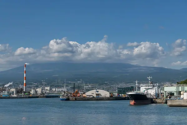 stock image Factory at Tagonoura shipping port with mount Fuji in Fuji city, Shizuoka Prefecture, Japan. Industrial Zone at dock.