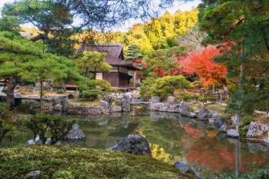 stunning Ginkakuji temple building and autumn garden view with reflection on pond in Kyoto, Japan. travel destination for tourist sightseeing of Kansai in fall season.