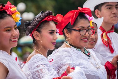 COATEPEC, VERACRUZ, MEXICO- SEPTEMBER 25, 2022: Young men and women dressed with traditional clothes from Veracruz at magical town of Coatepec, Veracruz