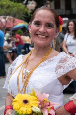 COATEPEC, VERACRUZ, MEXICO- SEPTEMBER 25, 2022: Portrait of smiling latin woman dressed with traditional clothes from Veracruz, Mexico at Coatepec, Veracruz, Mexico