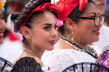 COATEPEC, VERACRUZ, MEXICO- SEPTEMBER 25, 2022: Portrait of latin women dressed with traditional clothes from Veracruz at magical town of Coatepec, Veracruz, Mexico