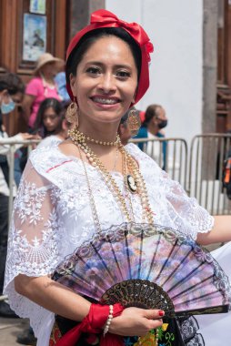 COATEPEC, VERACRUZ, MEXICO- SEPTEMBER 25, 2022: Portrait of smiling latin woman dressed with traditional clothes from Veracruz, Mexico at Coatepec, Veracruz, Mexico