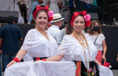 COATEPEC, VERACRUZ, MEXICO- SEPTEMBER 25, 2022: Portrait of two smiling women dressed with traditional clothes from Veracruz, at magical town of Coatepec, Veracruz, Mexico