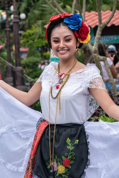 COATEPEC, VERACRUZ, MEXICO- SEPTEMBER 25, 2022: Portrait of a smiling girl dressed with traditional clothes from Veracruz at Coatepec, Veracruz, Mexico