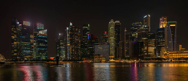 Landscape view of Singapore business district and city night district dusk sky. Singapore cityscape at dusk building around Marina bay. Concept of Travel trip in asia cityscape landmark