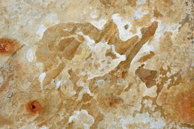 çatlakları, arka planı ve gölgesi olan taş bir duvarın dokusu