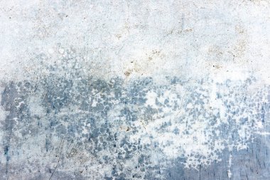 Gri noktalarla kaplı eski beton duvarın dokusu