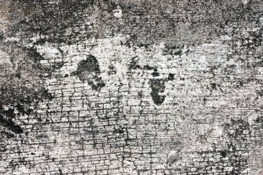 Eski gri ve beyaz çatlaklardan oluşan bir duvarın dokusu