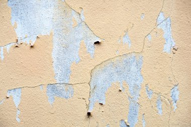 Eski beton duvar arkaplanındaki çatlak boya.