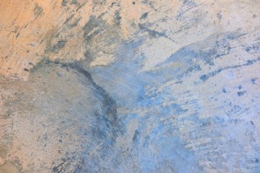 Çatlaklarla boyanmış eski bir beton duvarın dokusu.