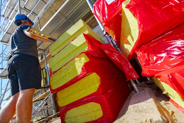 Boss Oversees Controls Work Construction Site Packages Thermal Insulation Material — стоковое фото