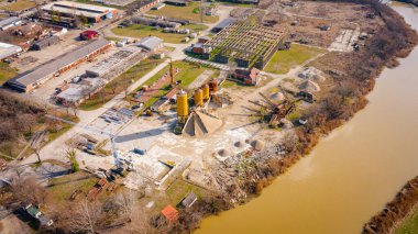 Above view, industrial complex, few silos, separator for extracting gravel in a large pit. Crushing factory, machines and equipment for crush, grinding stone, sorting sand and bulk materials clipart