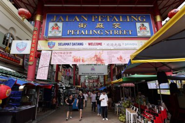 Kuala Lumpur, Malaysia November 18 2024 Shoppers on Jalan Petaling in Chinatown, Kuala Lumpur: A Bustling Market Scene clipart