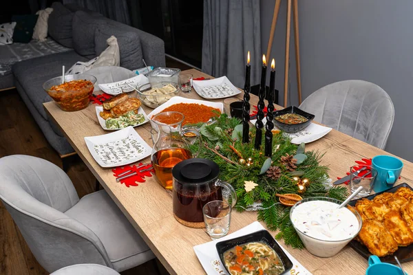 A table set before Christmas dinner with many traditional Polish dishes.