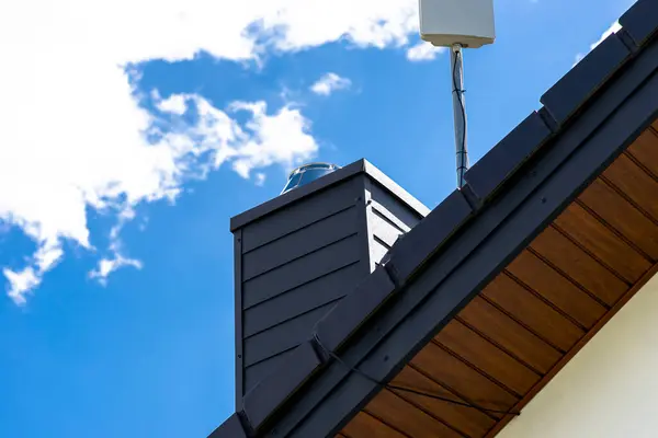 stock image Antenna amplifier for home mobile Internet and a TV receiver mounted on the chimney.