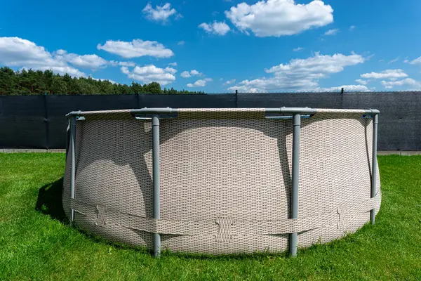 stock image Large expansion pool with a diameter of 3.96 m, located in the yard on the grass.