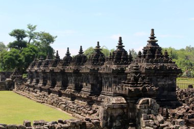 Line of stupa around Plaosan temple complex in Java, Indonesia. Taken July 2022.