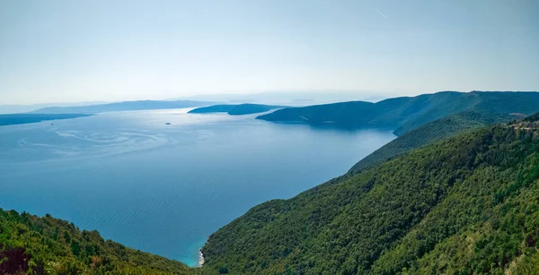 stock image Mountainous coastline of island Cres covered with forest and pristine sea