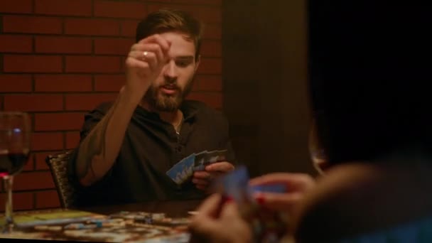 Man Plays Board Game Friends Has Tattooed Arms Beard Throws — Stock Video
