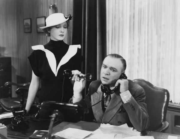 Secretary Holding Receiver While Waiting Boss Talking Telephone Office Stock Image