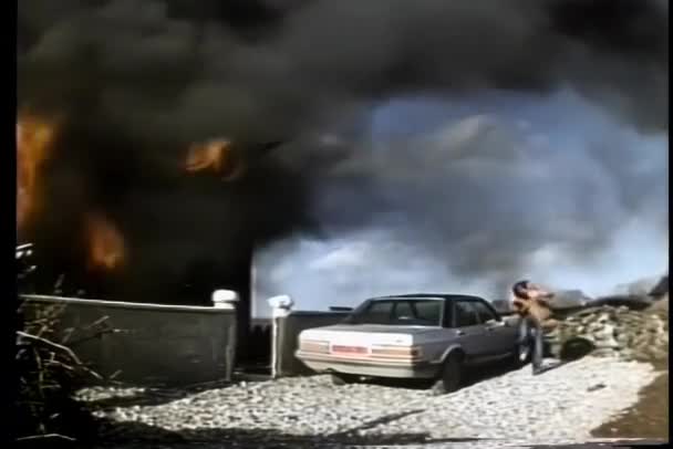 Wide Shot Man Running Burning House — Stock Video