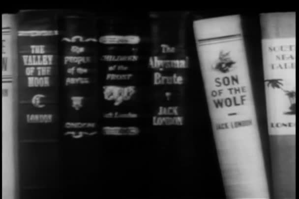 Panning Shelf Filled Books Written Jack London — Stock Video